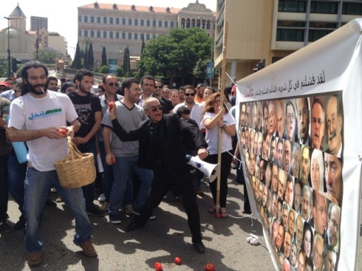 A handful of protesters take to the streets on May 31, 2013 protesting the Lebanese parliament's extension of its term. Protesters threw tomatoes at a canvas of the 128 MPs. Picture by http://www.beirutreport.com/ - Habib Battah